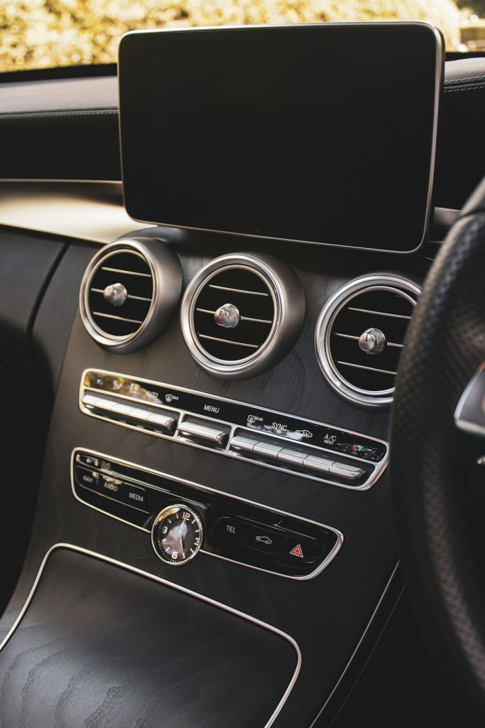 a-car-dashboard-with-a-black-speaker-dp-07zmrgku