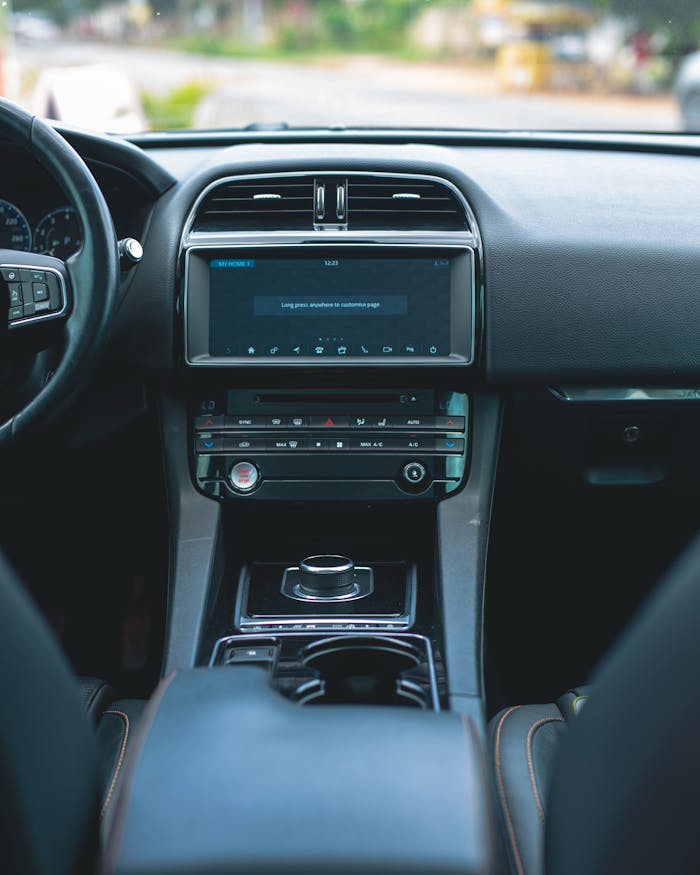 Explore the sleek design of a luxury car interior with high-tech features and premium materials.